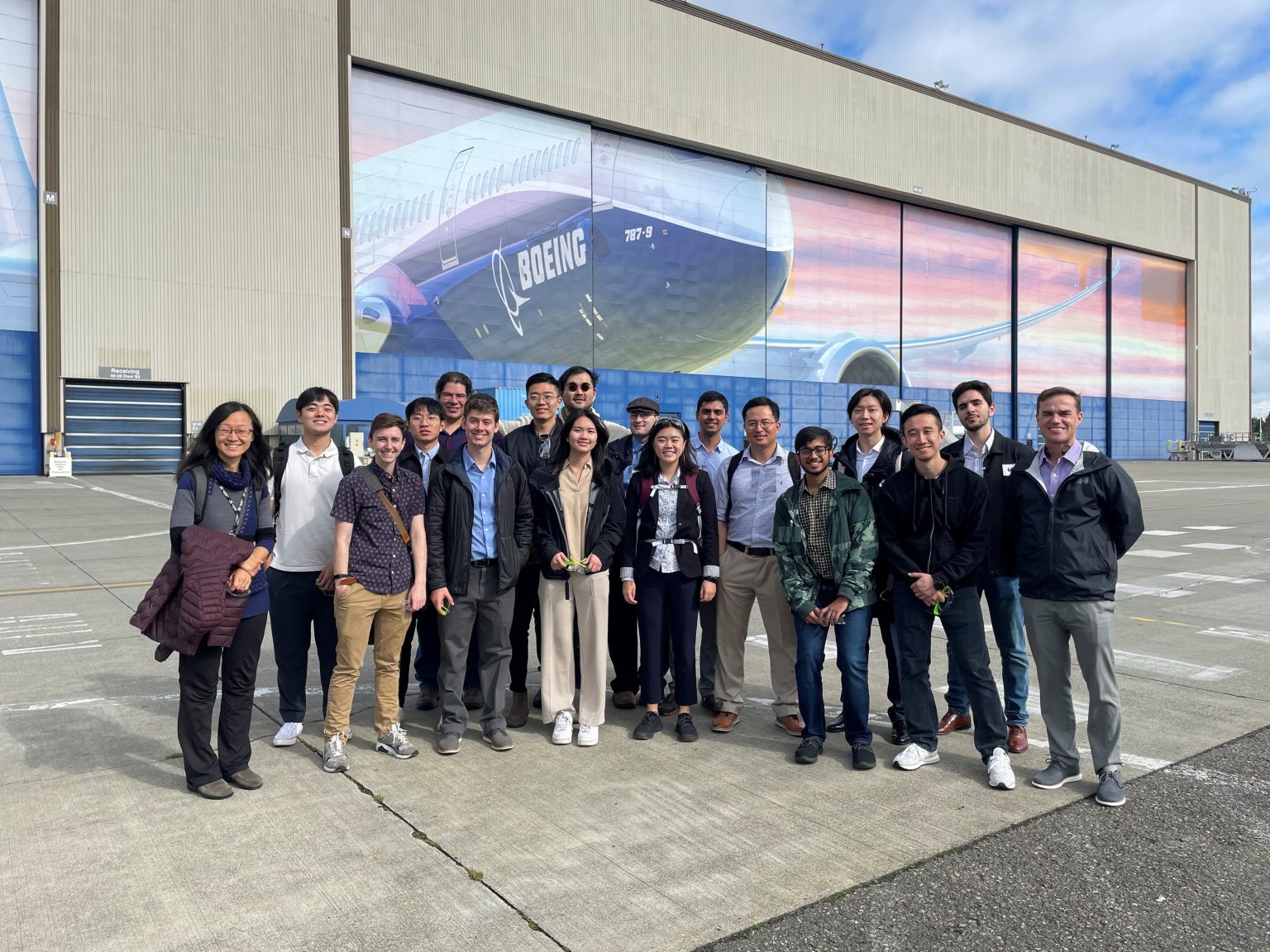 Students outside of Being headquarters posing for photo.